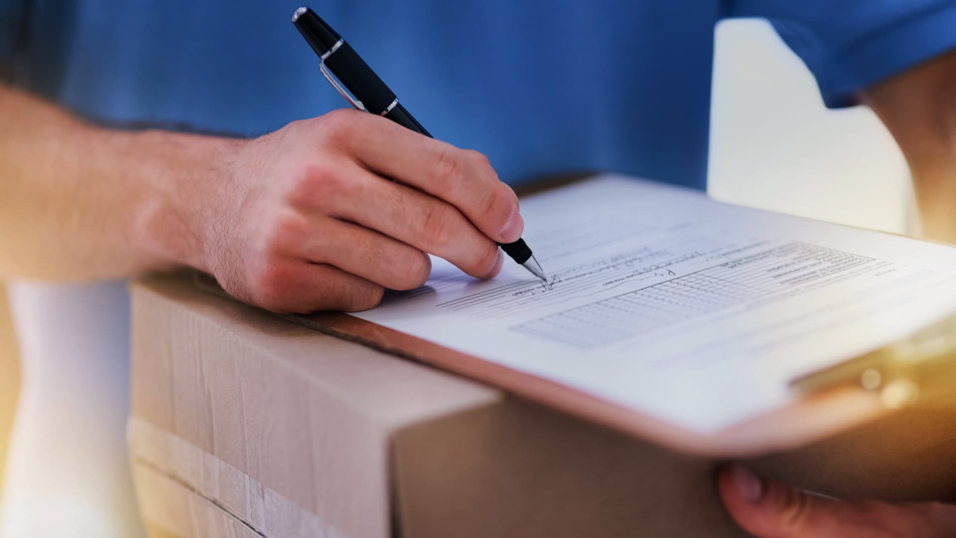 Recipient signs delivery form on package – Proof of Delivery (POD) as confirmation of proper shipment