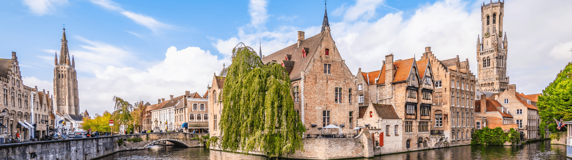 Historic old town of Bruges with canal and belfry in Belgium