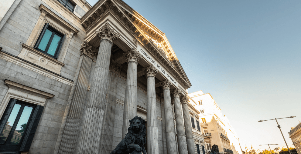 Spanish Parliament building in Madrid with columned facade in sunlight
