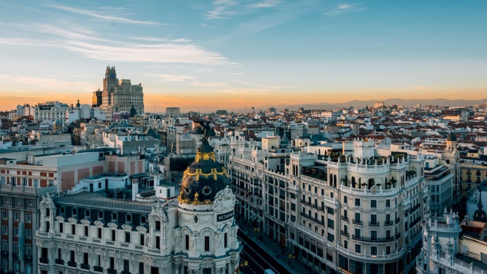 City view of Madrid with historic architecture and dense urban centre at sunset