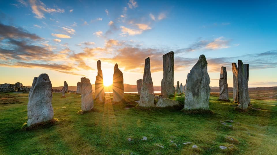 Sunrise over the Callanish Stones in Scotland – symbolizing the scenic diversity and nature in the United Kingdom.
