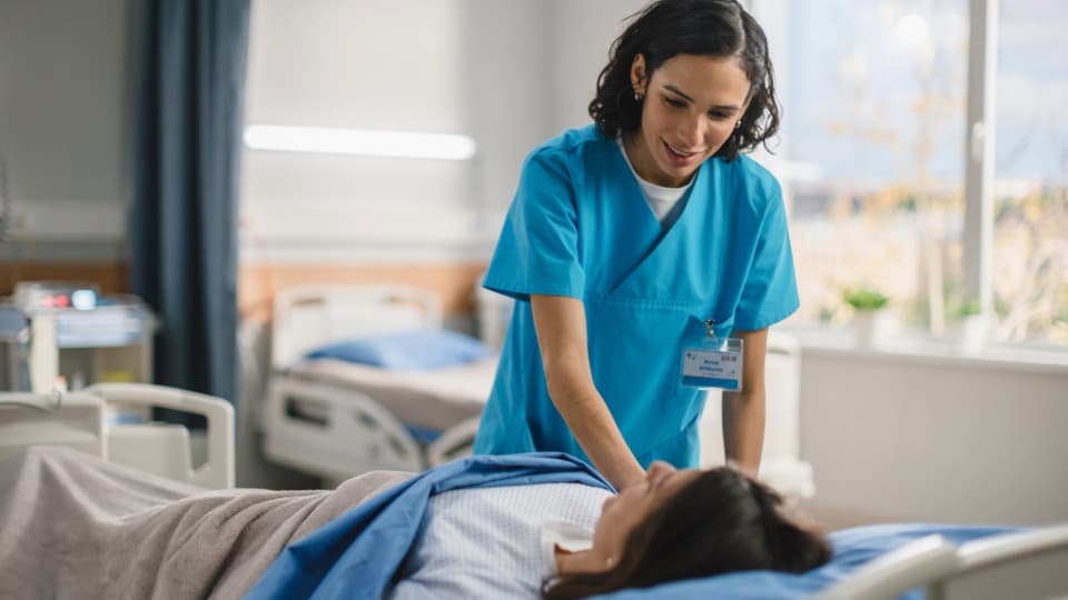 A Bolivian nurse is caring for a patient