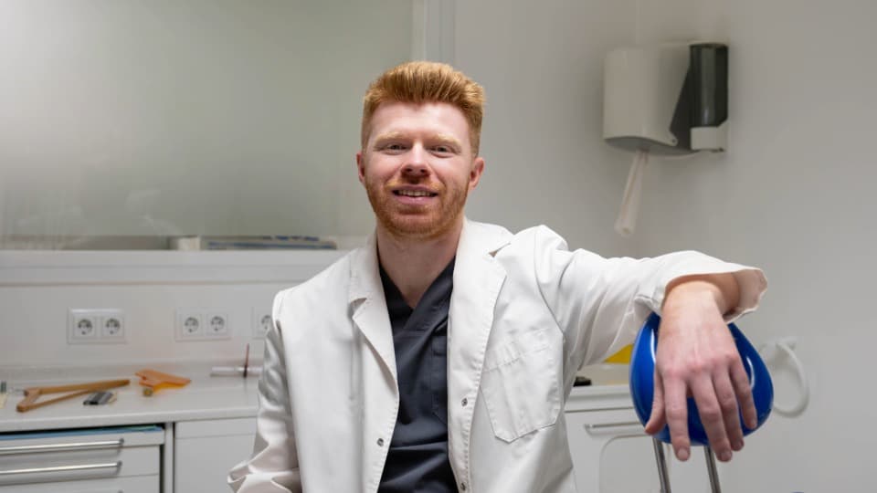An Irish doctor in a modern medical practice, symbolizing healthcare and medical insurance in Ireland.