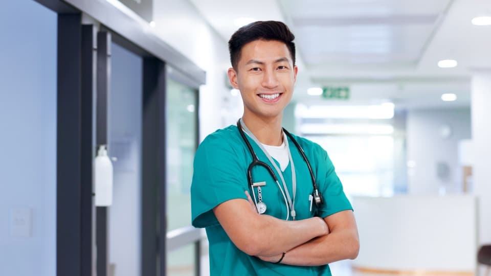 A doctor from Cambodia smiles at the camera