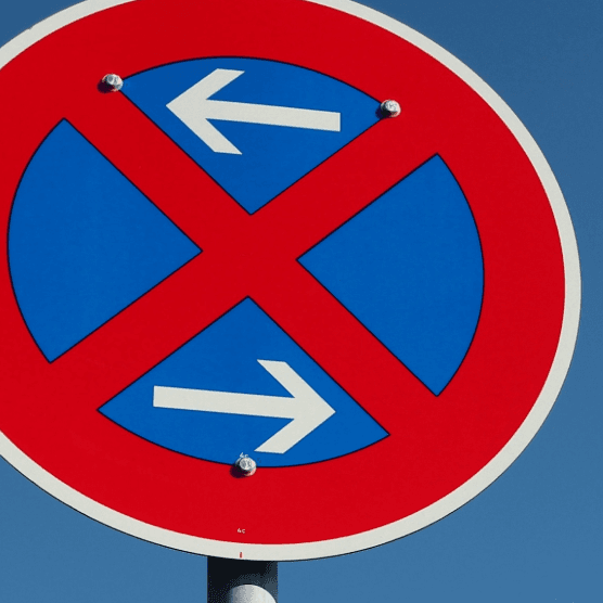 No stopping sign (arrows left/right). Information to apply for a no-parking zone