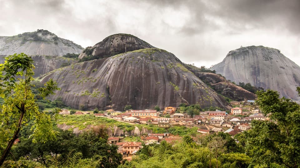 Aerial view of a landscape in Nigeria; mountains can be seen in the background