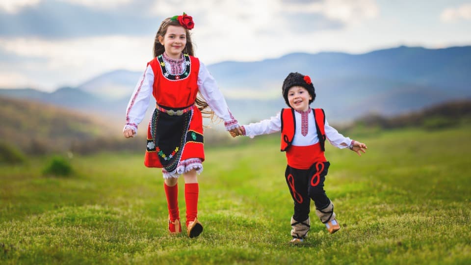 Children in traditional Bulgarian costumes – symbolizing the strong cultural identity and customs in Bulgaria.