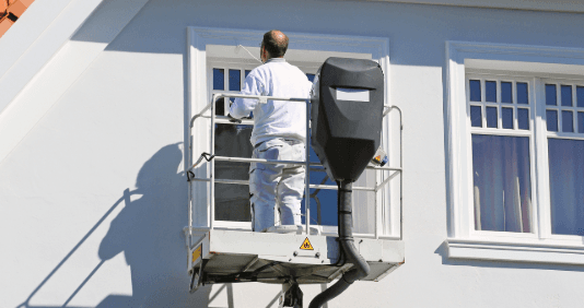 Furniture lift in use transporting furniture to a balcony. Movers. Barrier-free access.