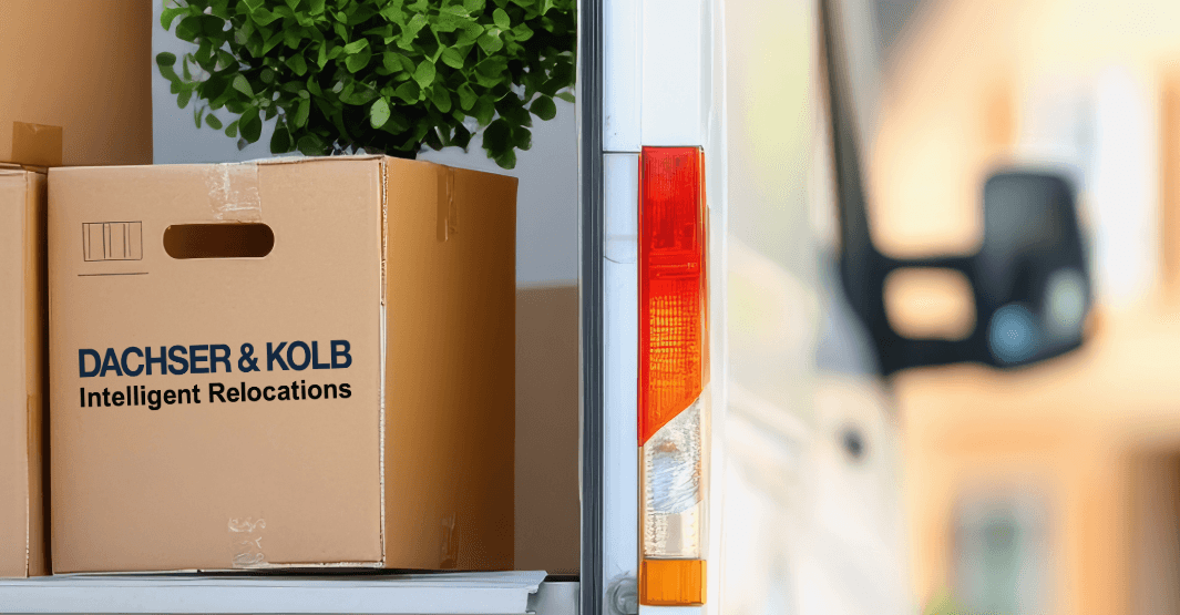 A Dachser & Kolb moving truck with stacked moving boxes, ready for a move or furniture logistics.