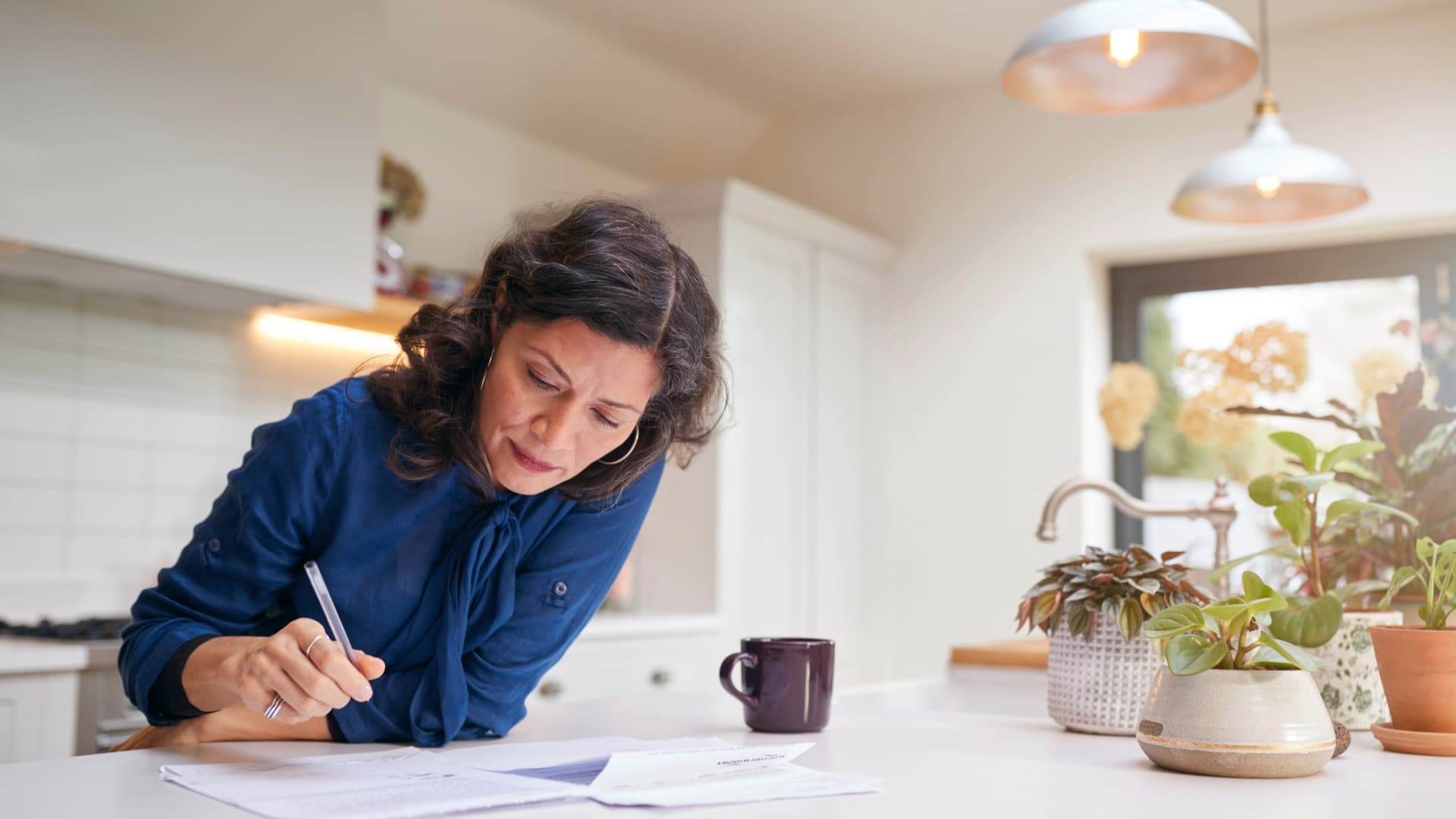 Customer filling out moving paperwork – Origin Service documents at the departure location