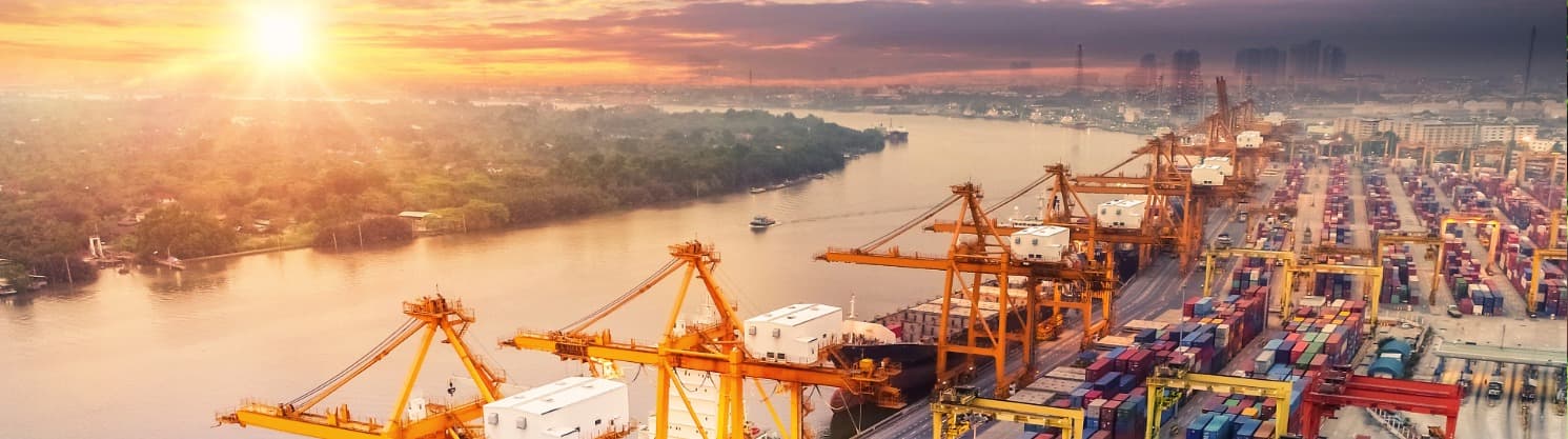 Container ship with tug from above – symbolic of navigation safety and maritime transport accidents