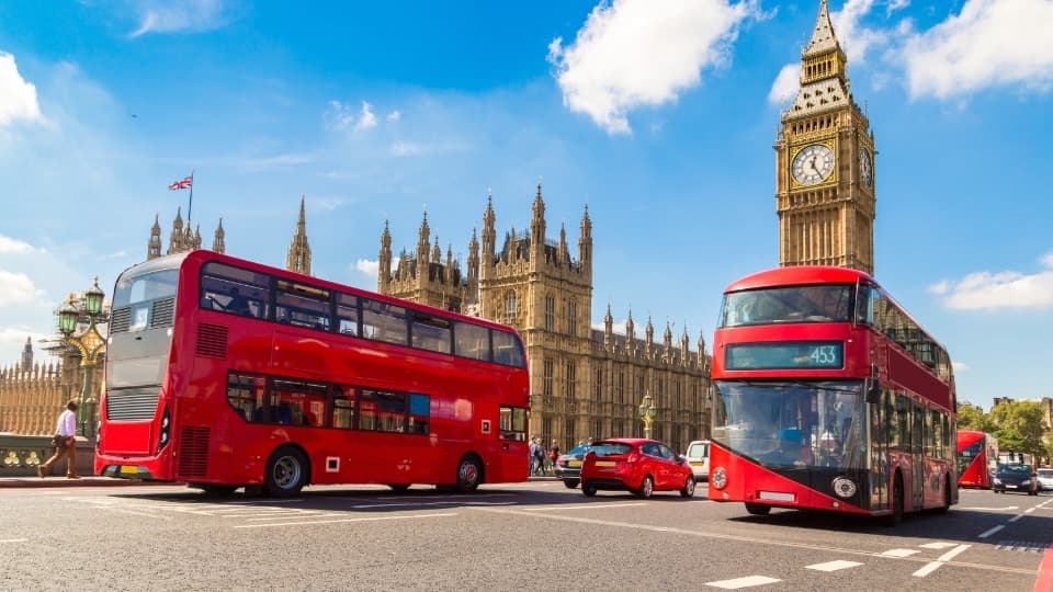 Red double-decker buses in front of Big Ben – a reminder to stay vigilant in public transport and at London hotspots.