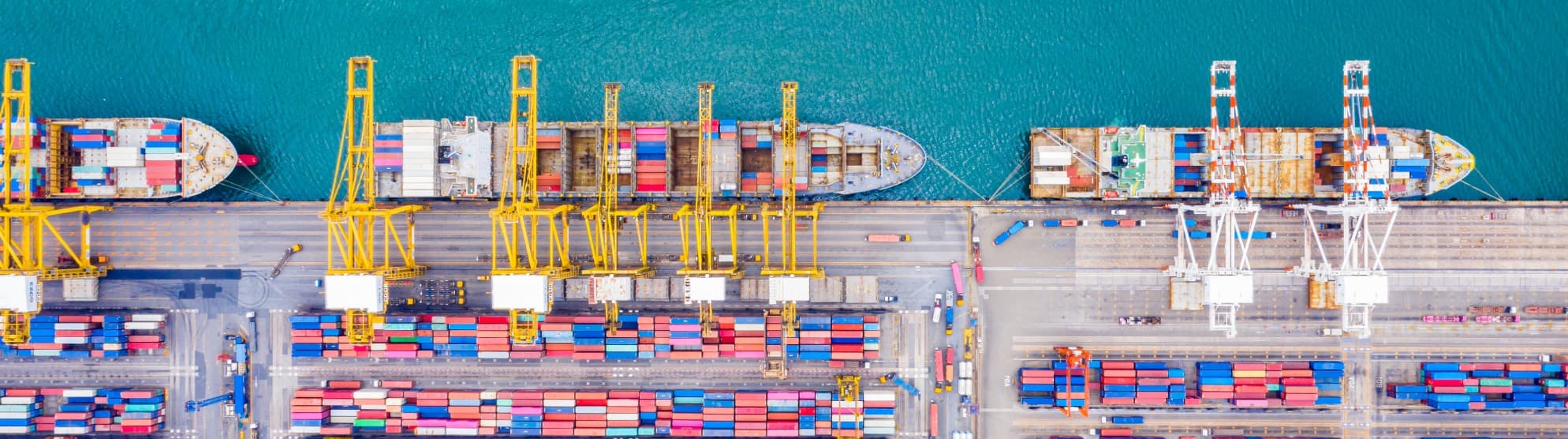 Container ship with tug from above – symbolic of navigation safety and maritime transport accidents
