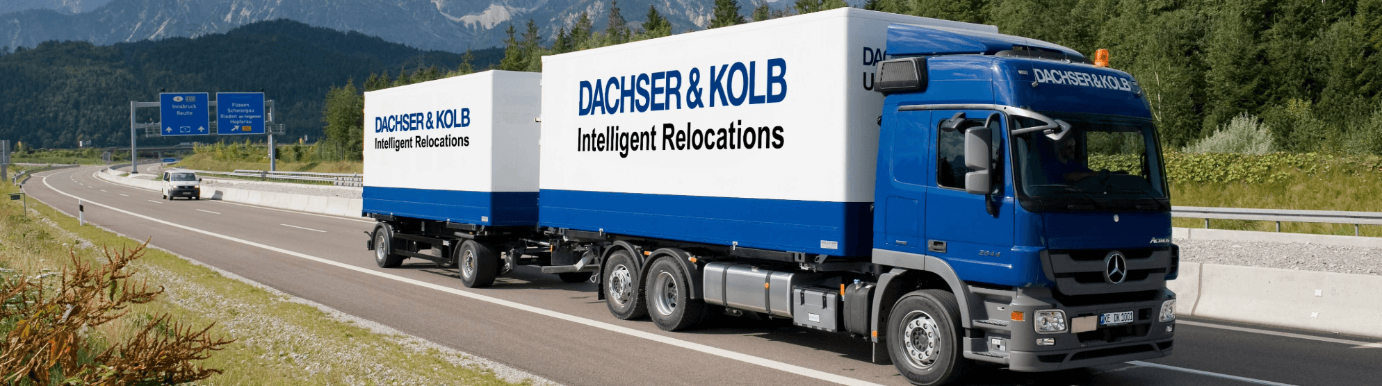 Truck on the highway – DACHSER & KOLB provides professional relocation services.