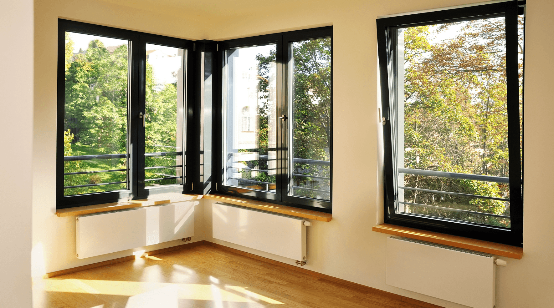 Bright room with large windows and green view – modern urban living trend in big cities