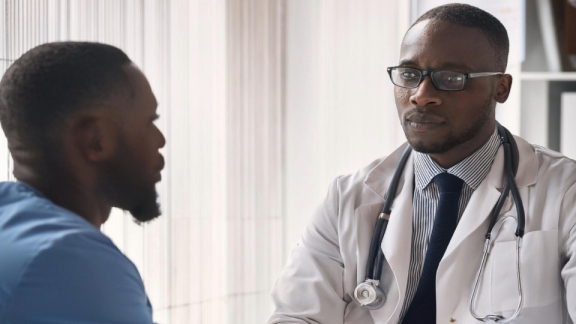 A doctor from Madagascar is talking to a patient