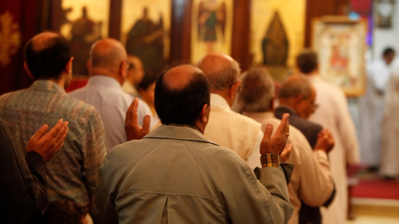 Religion in Egypt - several men praying during a Muslim service