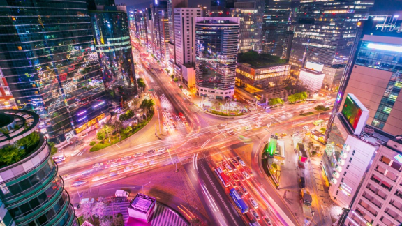 Night skyline and busy intersection in Seoul’s business district with heavy traffic