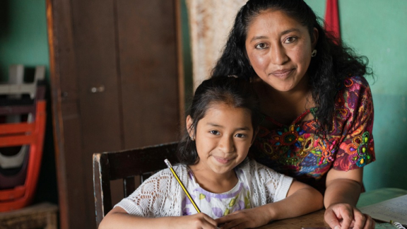 Culture in Paraguay - A girl practices Guarani with her mother