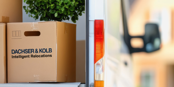 A Dachser & Kolb moving truck with stacked moving boxes, ready for a move or furniture logistics.