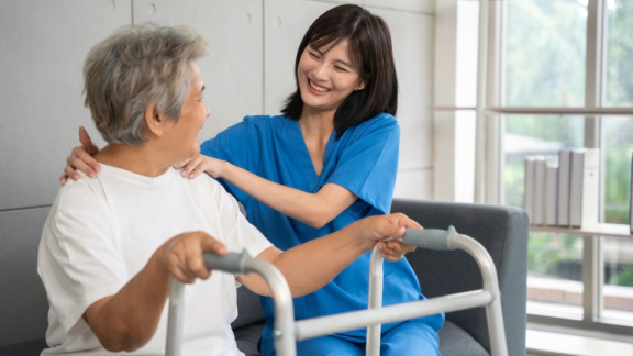 A nurse is caring for an elderly Filipino patient