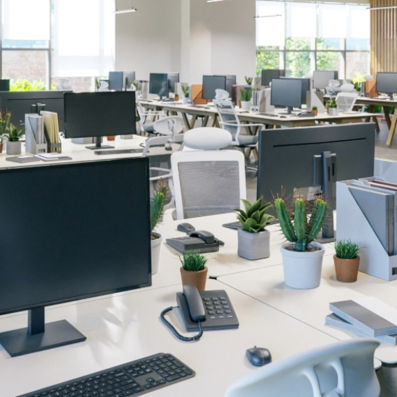 Modern open-plan office with perfectly set up IT workstations after the corporate relocation.