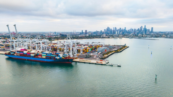 Large container ship at the Port of Melbourne for international overseas relocation and inland transport to Australia with DACHSER & KOLB.