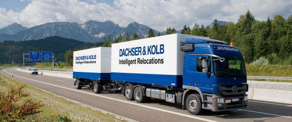 Moving company truck on the highway – DACHSER & KOLB provides professional relocation services.